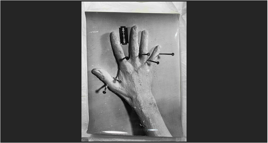 Günter Brus, Self-Painting (Hand Painting – Head Painting – Head Addition), December 1964, John Sailer Studio, Opernring 21, 1010 Vienna, black-and-white photograph, photo by Ludwig Hoffenreich.